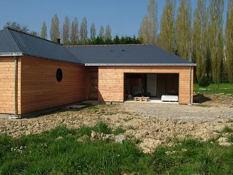Garage ossature en L avec partie ouverte