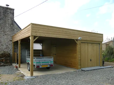 Carport accolé à un garage ossature toit plat